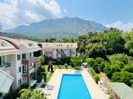 Apartment in Aslanbudcak, Kemer with pool - buy realty in Turkey - 107043